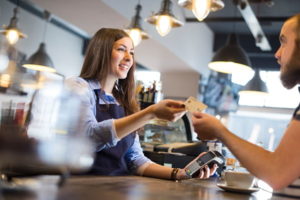 man buying coffee with credit card