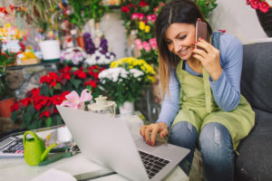 Florist taking orders on the phone