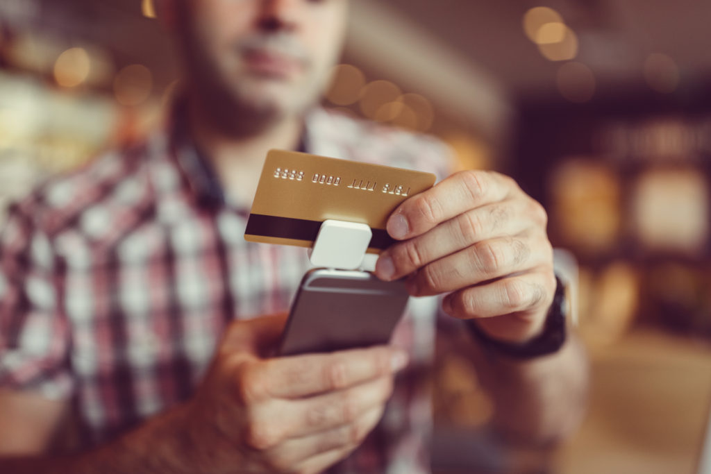 Man using square for a credit card payment