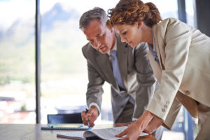 businessman signing a business line of credit document