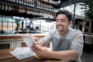 Manager doing the books at a restaurant