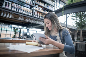 Small business owner calculating a small business loan