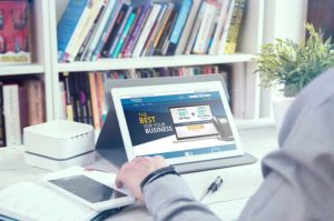 Man works with financial analysis application for a pc tablet