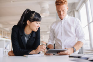 Business people working together on digital tablet