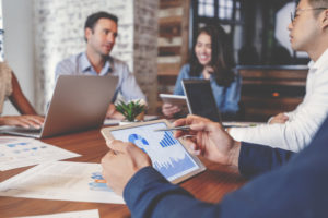 Group of people meeting with technology.