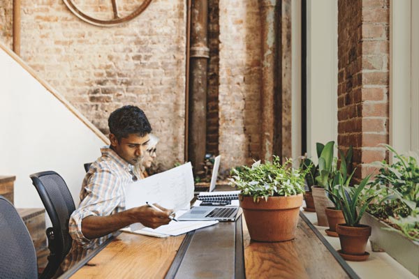 Indian-man-working-at-conference-table