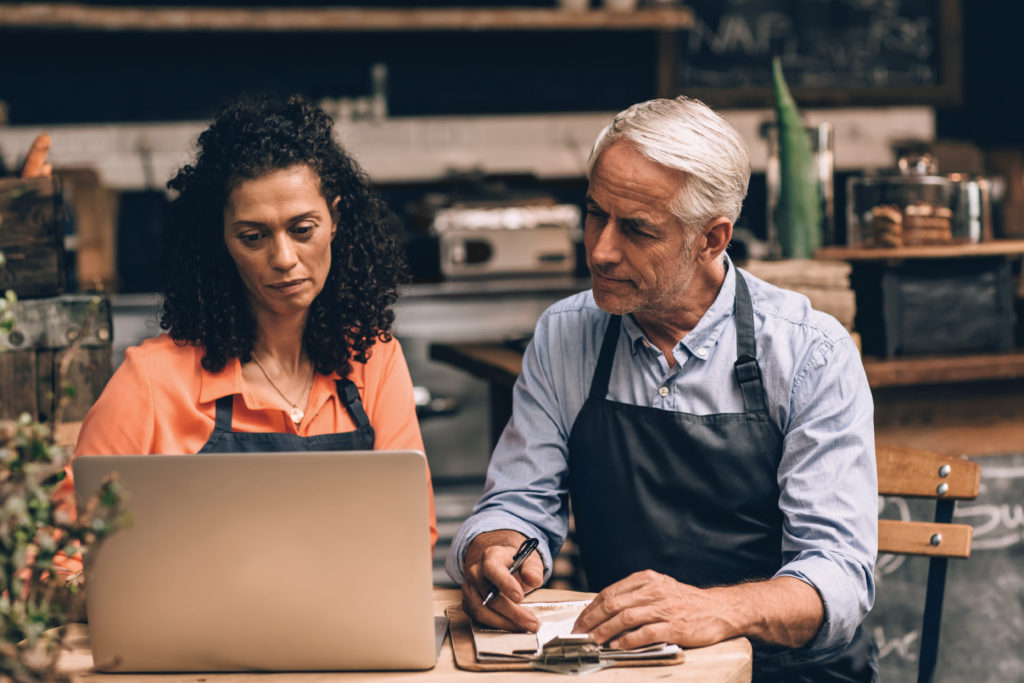 Two business owners doing their business accounting