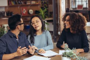 people talking around a table
