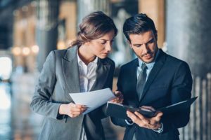 man-and-woman-going-over-paperwork