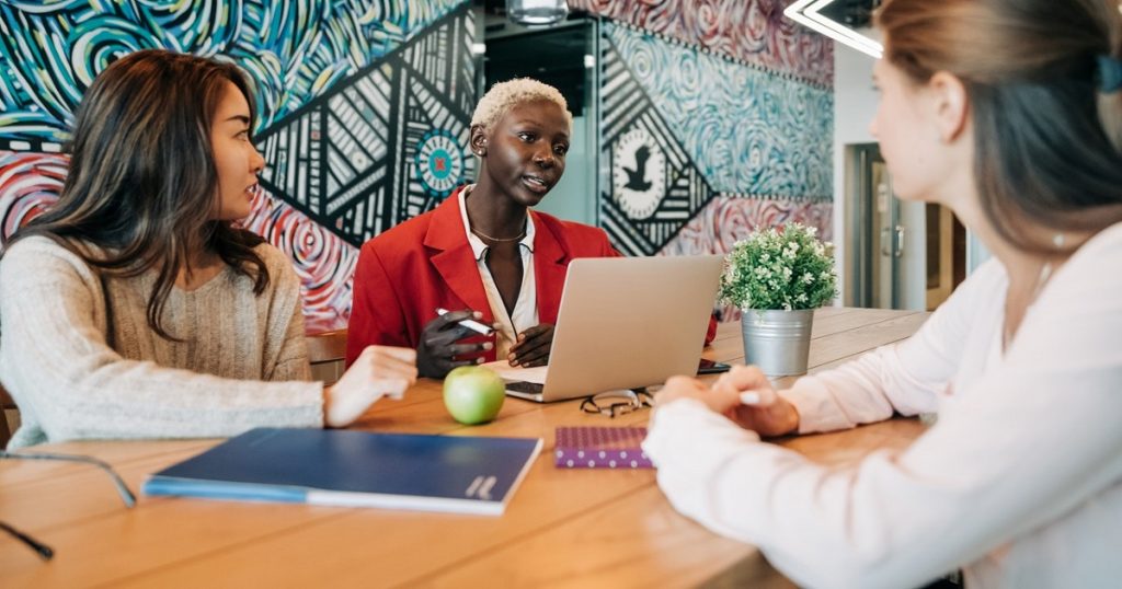 Business people with laptop at desk