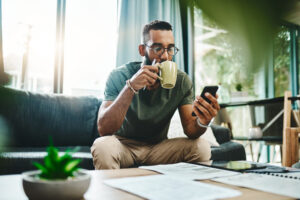 Man reviewing SMS marketing tactics on his cellphone