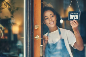 Woman opening her small business for the day