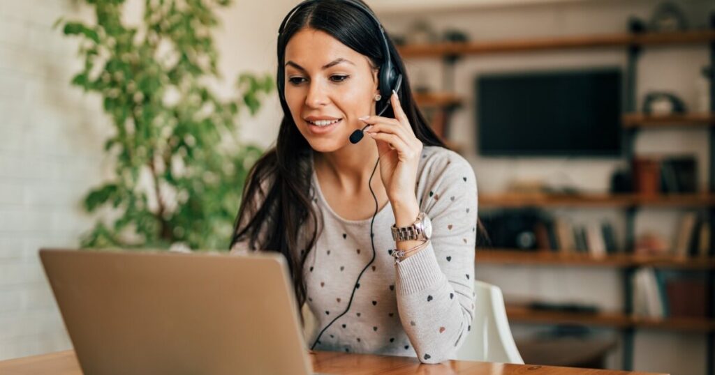 Woman working from home trying to overcome the midday slump.