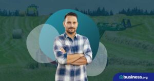 Man standing arms cross outside the farming fields