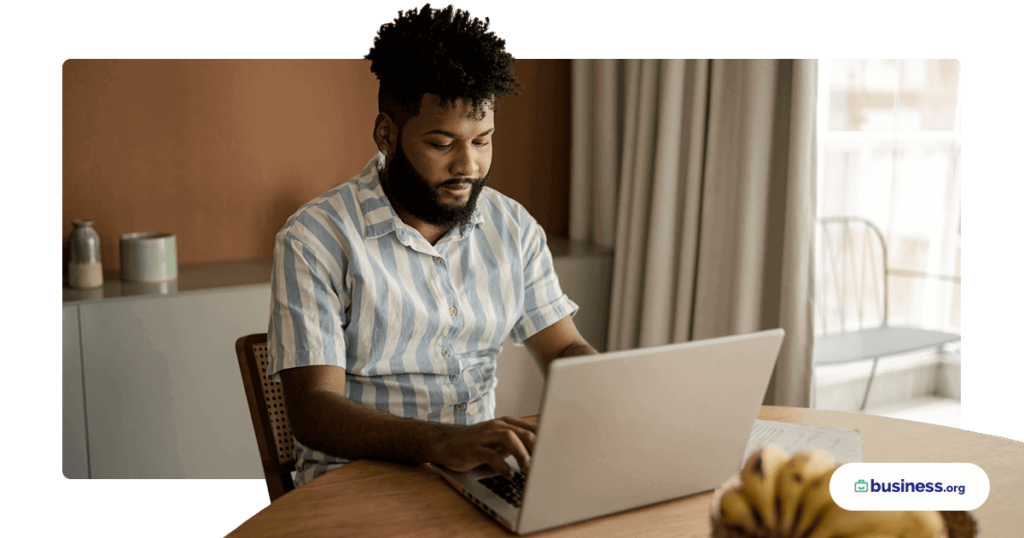 male sitting in comfortable room using laptop