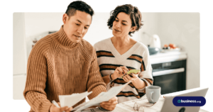 couple sitting in kitchen working