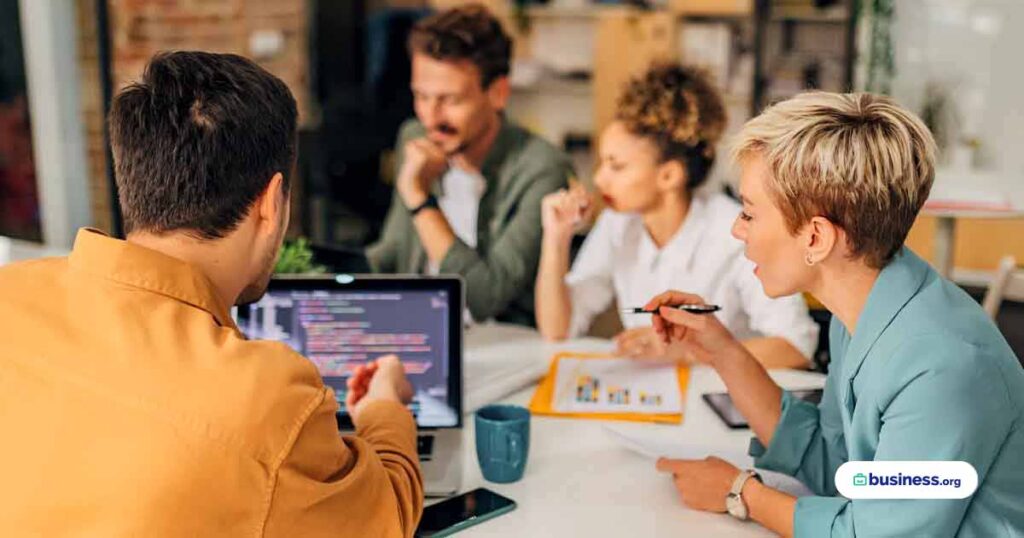 coworkers-in-office-talking-about-computer-safety