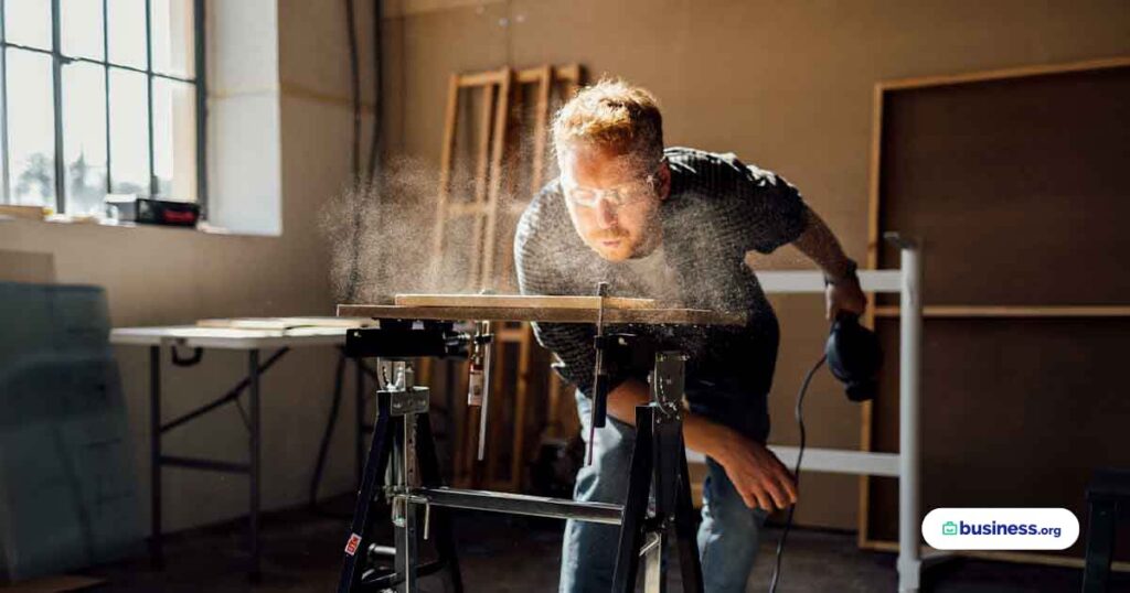 woodworker-blowing-sawdust