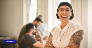 happy-employee-with-tattoos-in-an-office