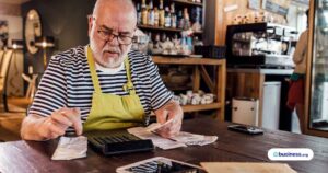 person-working-on-accounting-at-coffee-shop