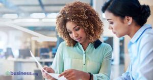 two women in a conference room