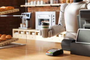 Robot serving a coffee from behind the counter of a small business